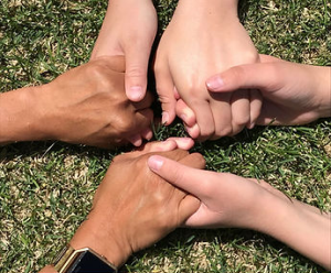 People holding hands.